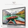 A beautiful scenenery of a lake with rowboats and mountains displayed on a bathroom TV.